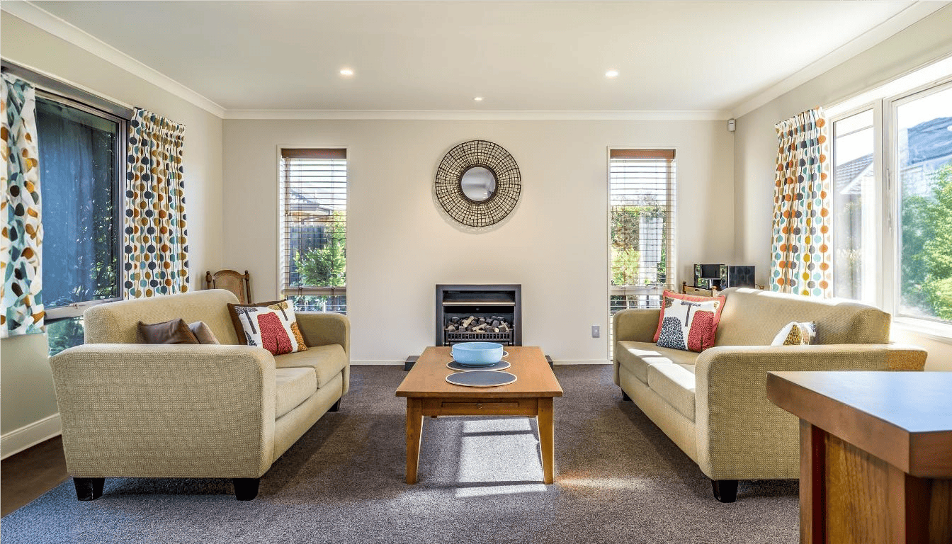 Living room with simple gypsum ceiling design, LED downlights and fireplace